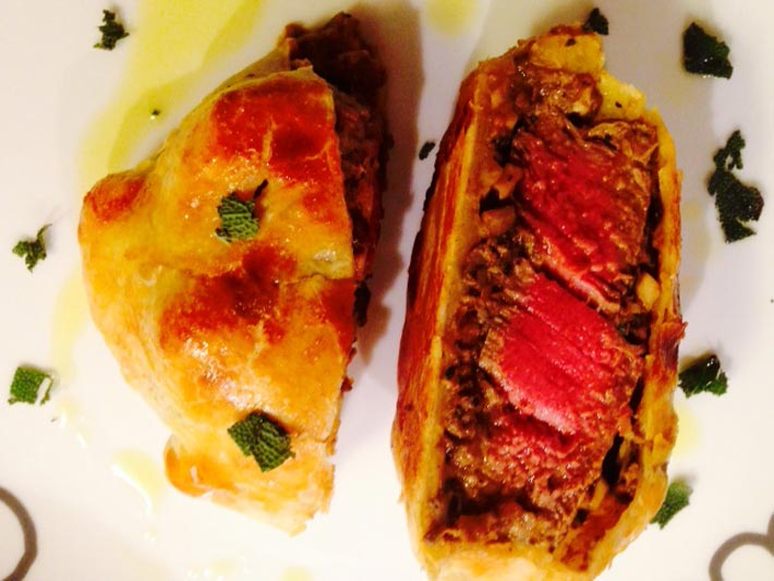 Beef Wellington Recipe - that is a flaky pocket of beefy tangy mushrooms on top of a juicy peppery steak. This is perfect for a dinner party, #weeknightrecipe, or a happy #dinner. Hope this is your new favorite #comfortfood #recipe.