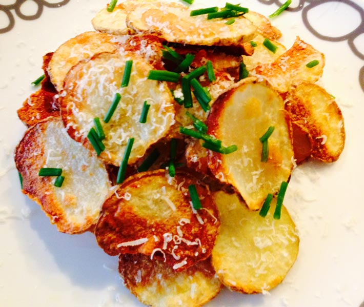 Homemade Parmesan Potato Chips Recipe- that is oven baked perfection. Grab your potatoes, Parmesan, and smiles. This is super easy #comfortfood. www.ChopHappy.com