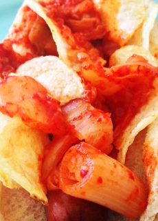 Kimchee Potato Chip Hot Dogs Recipe that is super quick to make. This is spicy, sweet, and comfort food yum. Grab kimchi, chorizo, and a hot dog. Happy Cooking! www.ChopHappy.com #hotdogrecipe #kimchirecipe