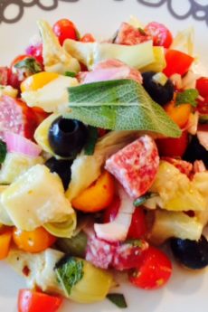 Salami Salad Recipe. Grab all your favorite Italian meats and cheese for a salty sweet salad. This si the best antipasti salad filled with salami, prosciutto, Parmesan, olives, basil, tomatoes, and vinaigrette. Happy Cooking! www.ChopHappy.com #Italiansalad #salami