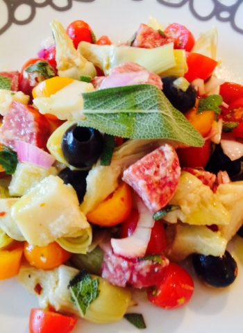 Salami Salad Recipe. Grab all your favorite Italian meats and cheese for a salty sweet salad. This si the best antipasti salad filled with salami, prosciutto, Parmesan, olives, basil, tomatoes, and vinaigrette. Happy Cooking! www.ChopHappy.com #Italiansalad #salami