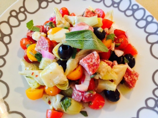 Salami Salad Recipe. Grab all your favorite Italian meats and cheese for a salty sweet salad. This si the best antipasti salad filled with salami, prosciutto, Parmesan, olives, basil, tomatoes, and vinaigrette. Happy Cooking! www.ChopHappy.com #Italiansalad #salami