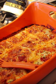 Magical Ravioli Lasagna Recipe - is easy comfort food fun. Grab raviolis, tomato sauce, cheese, and lots of Parmesan cheese. www.ChopHappy.com #lasagna #ravioli