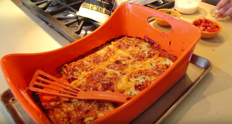 Magical Ravioli Lasagna Recipe - is easy comfort food fun. Grab raviolis, tomato sauce, cheese, and lots of Parmesan cheese. www.ChopHappy.com #lasagna #ravioli 