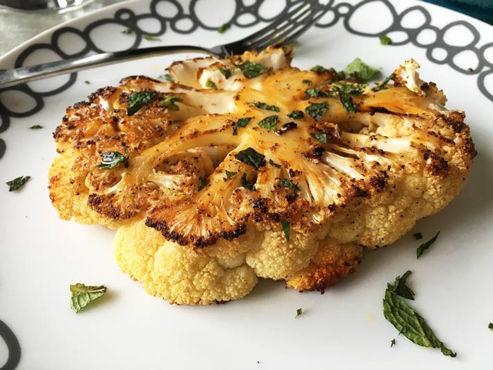 Roasted Cauliflower Steaks Recipe- is so hearty, and easy that you and your family will love this dinner recipe. www.ChopHappy.com