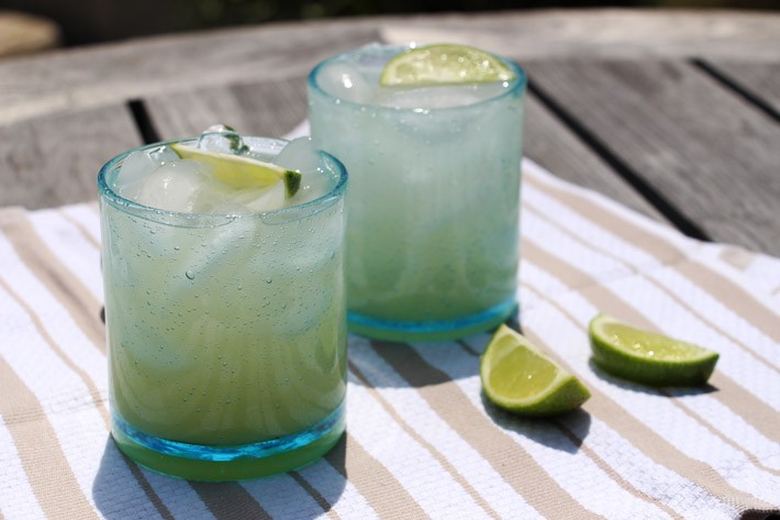 Sunshine Tequila Colada Recipe. Crazy easy with only a few ingredients. Grab tequila, coconut water, pineapple juice, and limes. This is a cocktail for a crowd. Happy drinking making. #tequila #easycocktailrecipe