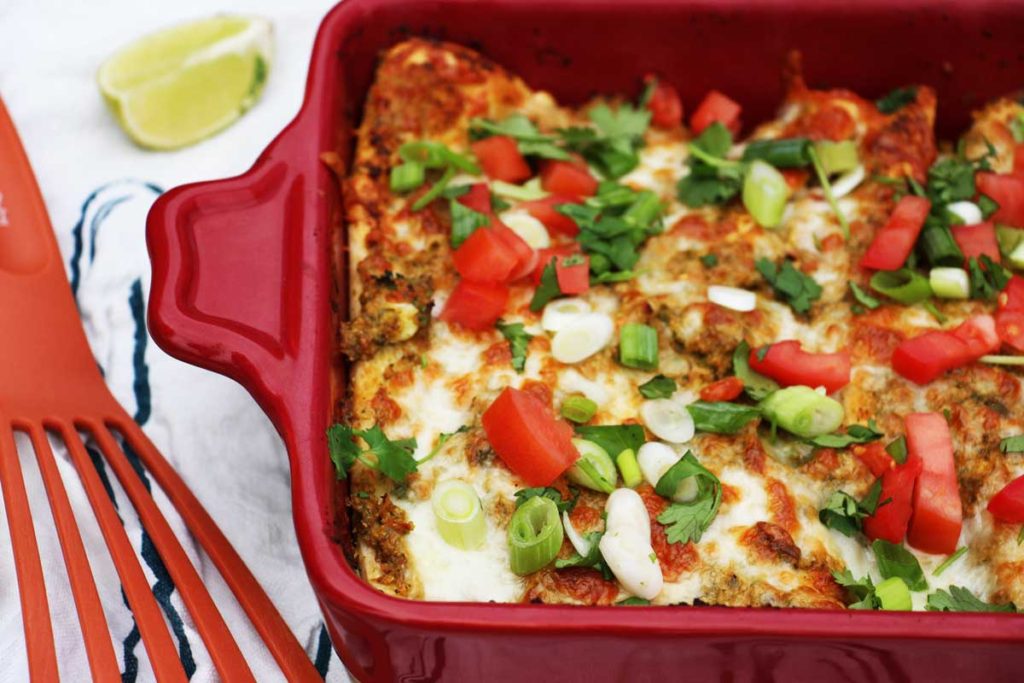 Cheesy Avocado Enchiladas Recipe. Easy quick dinner recipe. This also makes lots of leftovers. www.ChopHappy.com