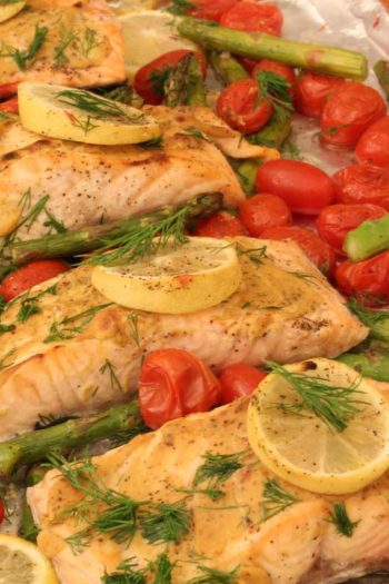 One Sheet Pan Dijon Salmon with Asparagus Recipe. It is so easy. All you have to do is put it on a sheet pan and bake. Perfect busy day dinner. www.ChopHappy.com