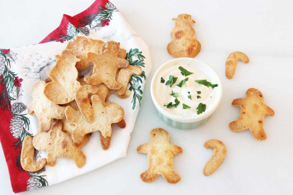 Christmas Tortilla Chips Recipe - is so christmas festive. This appetizer is is so easy to make. Grab tortillas, salt, garlic poweder, and make fun shapes. www.ChopHappy.com