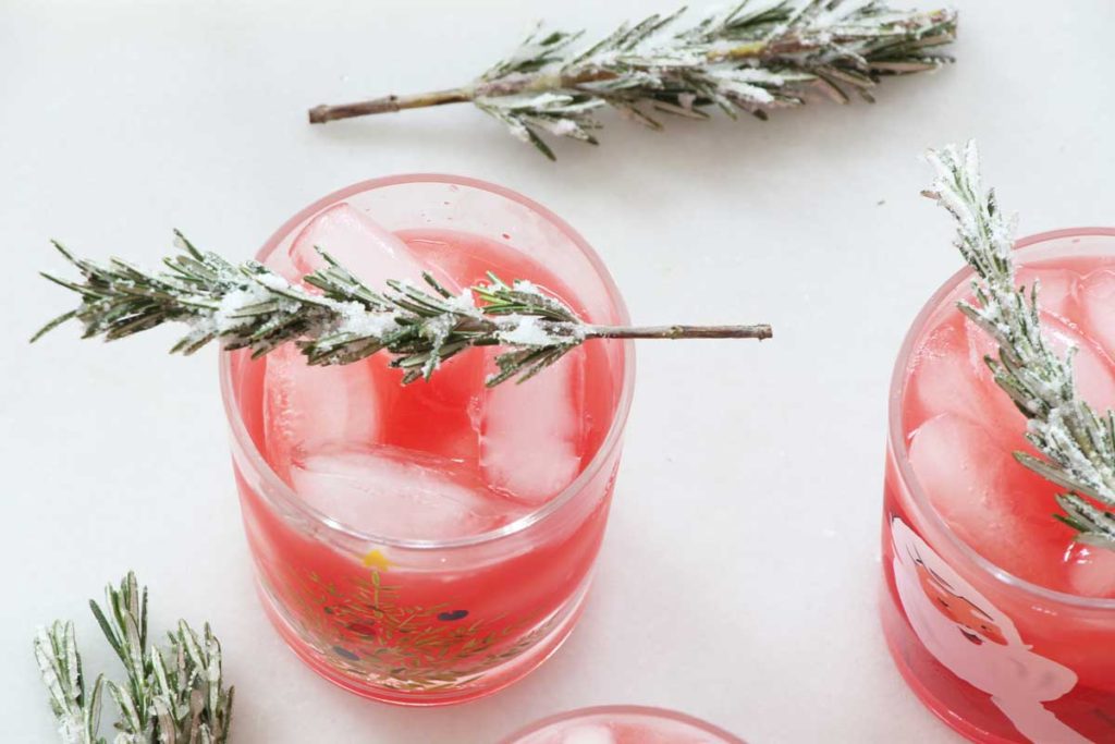 How to Make Snowy Tree Garnish (Sugared Rosemary)- perfect Christmas cocktail garnish. Grab rosemary, sugar, and water and the magic happens. This is edible crafting. www.ChopHappy.com