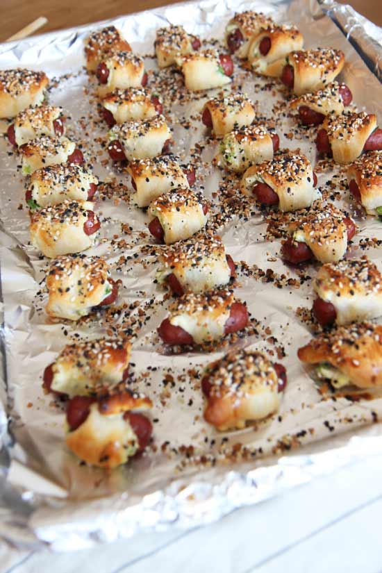 Everything Bagel Pigs in a Blanket Recipe - is crunchy, cheesy, garlicky and salty flavor yum appetizers. Grab crescent dough, everything bagel seasoning, and hot dogs for a super easy recipe. www.ChopHappy.com