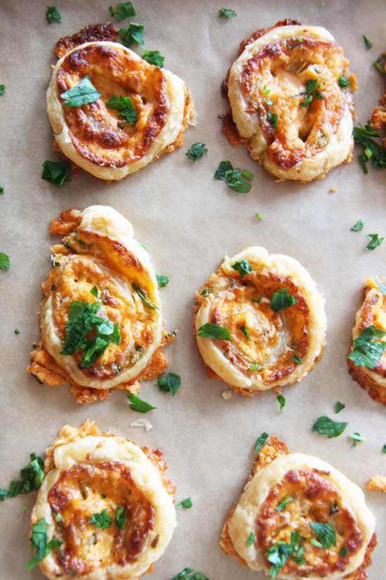 Jalapeno Popper Pinwheel (Happy Make Ahead Fun) Recipe - that is a perfect party food appetizer. There is sharp cheese, spicy jalapeño, and creamy cream cheese to form a comfort food happy bite. Happy Cooking. www.ChopHappy.com