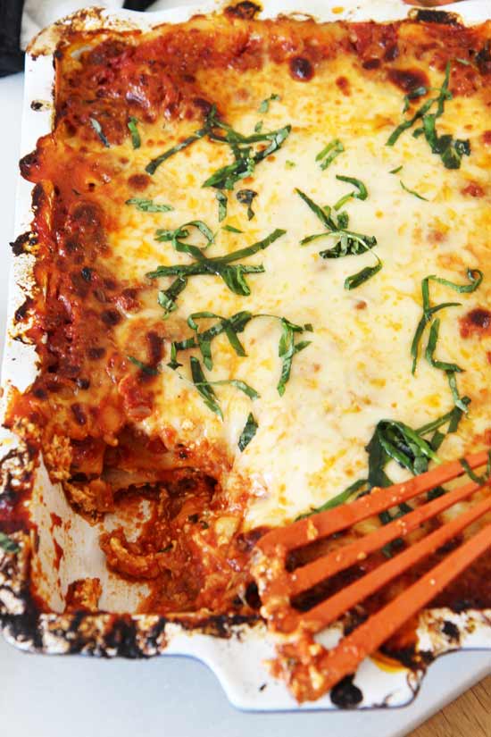 The Best Meat Lasagna Recipe - that will be your favorite Sunday night dinner recipe. It involves sweet and spicy sausage, pepperoni, and lots of cheese. This is perfect for leftovers for lunch the next day too. Happy cooking. www.ChopHappy.com