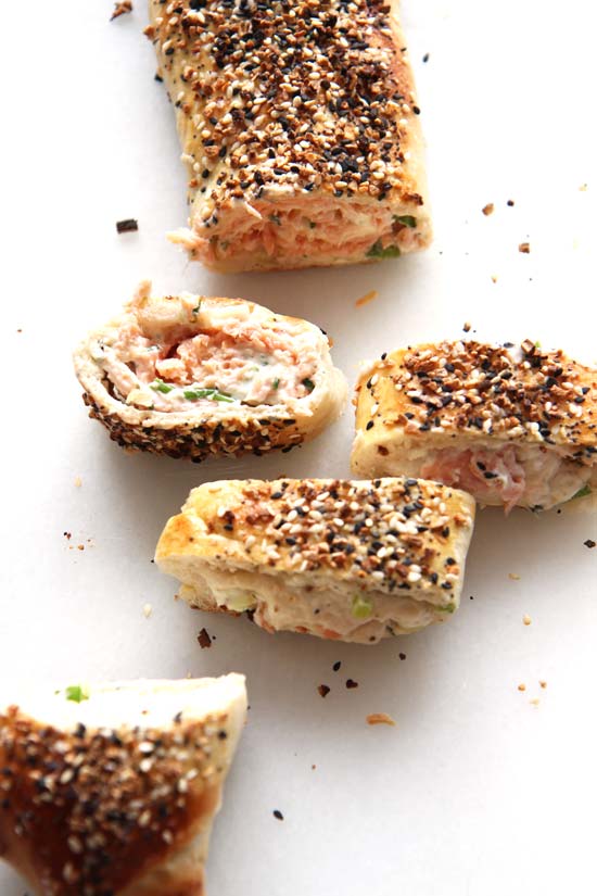 NYC Everything Bagel Stromboli Recipe - is so easy and every bite transforms you to a NYC bagel shop. Grab everything bagel seasoning, smoked salmon, cream cheese, and fun herbs. This will be your go to comfort food dinner recipe. Happy Cooking! www.ChopHappy.com