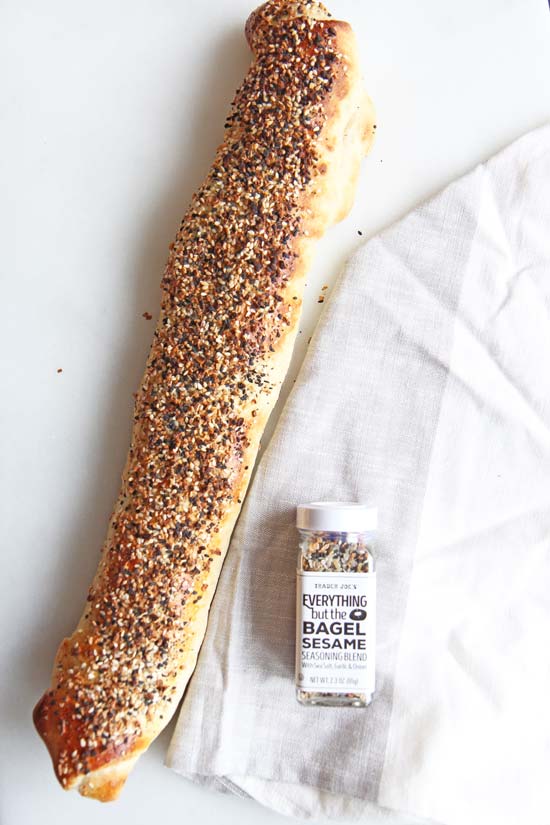 NYC Everything Bagel Stromboli Recipe - is so easy and every bite transforms you to a NYC bagel shop. Grab everything bagel seasoning, smoked salmon, cream cheese, and fun herbs. This will be your go to comfort food dinner recipe. Happy Cooking! www.ChopHappy.com