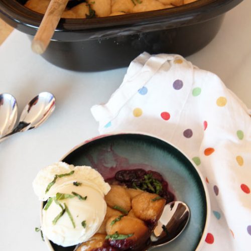 Slow Cooker Berry Cobbler Recipe- that is juicy sweet and flaky yummy. This is a super easy dessert. www.ChopHappy.com