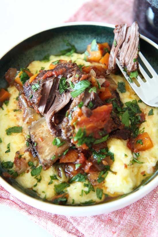 Slow Cooker Italian Short Ribs Ricipe. Grab #beef, tomatoes, and your #slowcooker. This is an easy epic dinner with great #leftovers. Happy cooking! www.ChopHappy.com #dinner #dinneridea