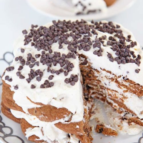 Cannoli Ice Box Cake Recipe. This is the easiest no bake dessert. Whip cream add ricotta, and warm spices. Layer cream and cookies. Then eat this indulgent cake. www.ChopHappy.com #cookies #iceboxcake #cannoli