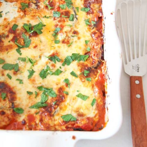 Best Baked Eggplant Parmesan Lasagna Recipe. We save time by roasting the eggplant for 10 minutes instead of breading and frying. This is a perfect weeknight dinner idea with lots of chess leftovers. Happy Cooking! www.ChopHappy.com #eggplantparmesan #dinneridea