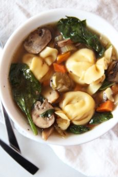 Simple Slow Cooker Tortellini Soup Recipe. The slow cooker is your personal chef. Drop chicken broth, veggies, and pasta and come home to warm easy dinner. www.ChopHappy.com #soup #slowcooker