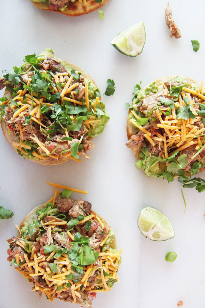 15 Minute Salsa Chicken Tostada Recipe. Grab your corn tortilla, rotisserie chicken, salsa, avocado, and cheese. This is baked in the oven and fast weeknight smiles. Happy Cooking! www.ChopHappy.com #chickenrecipe #tostada