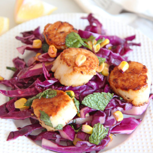 Scallops and Quick Cabbage Slaw Recipe. Grab scallops, red cabbage, shallots, apple cider vinegar, salt, pepper, mint, and enjoy! Easy summer recipe for busy weeknights! #scalloprecipe #slawrecipe