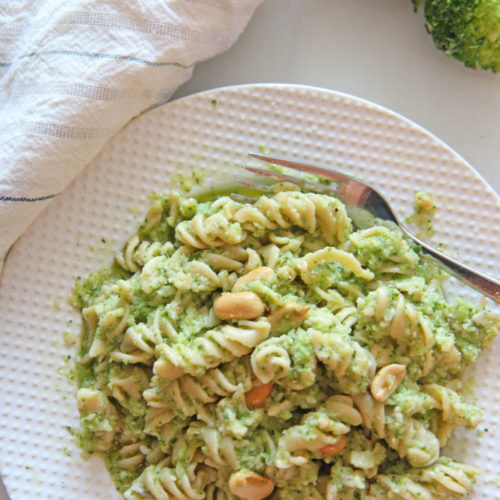 Broccoli Pesto Pasta Recipe. Grab broccoli, arugula, Parmesan, peanuts, and extra virgin olive oil. The secret ingredient is red wine vinegar to brighten it up. This is a 10 minute dinner recipe. Happy Cooking! www.ChopHappy.com #broccoli #pastarecipe