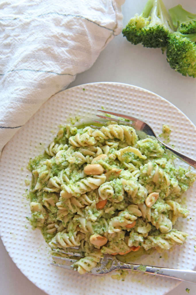 Broccoli Pesto Pasta Recipe. Grab broccoli, arugula, Parmesan, peanuts, and extra virgin olive oil. The secret ingredient is red wine vinegar to brighten it up. This is a 10 minute dinner recipe. Happy Cooking! www.ChopHappy.com #broccoli #pastarecipe