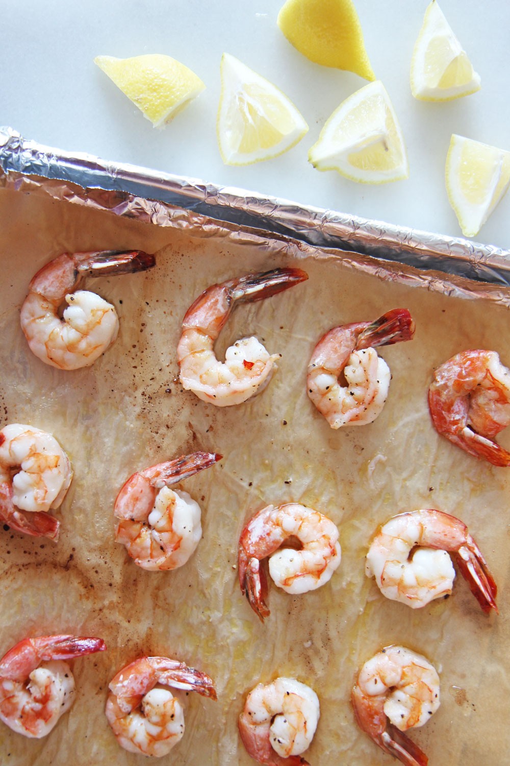 How To Make 8 Minute Sheet Pan Shrimp Recipe. Grab shrimp, garlic, extra virgin olive oil, salt and pepper. This is perfect for salad recipes, shrimp cocktails, and shrimp with pasta. Happy Cooking! www.ChopHappy.com #Howto cookshrimp #sheetpanshrimp