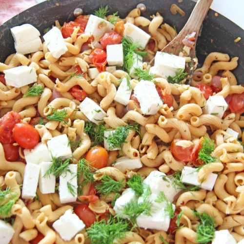 Bursting With Gratitude Tomato Feta Pasta Recipe. Grab sweet tomatoes, oregano, red pepper flakes, olive oil, pasta, and feta. This is a fast weeknight meal that takes only 15 minutes. Happy Cooking! www.ChopHappy.com #pastarecipe #GreekPasta