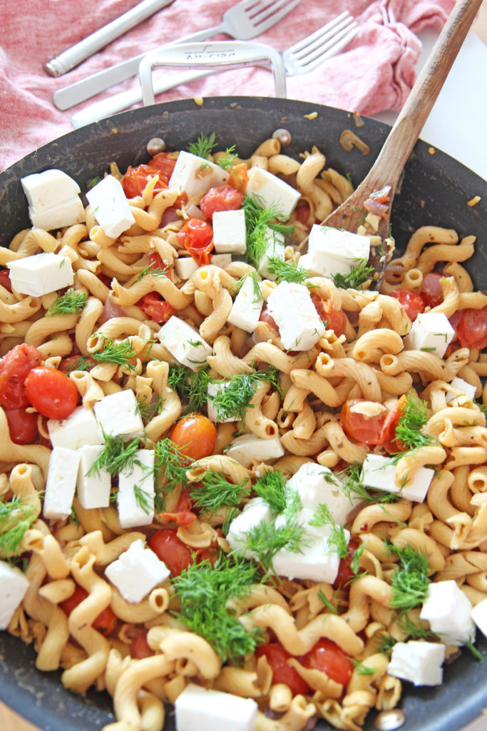 Bursting With Gratitude Tomato Feta Pasta Recipe. Grab sweet tomatoes, oregano, red pepper flakes, olive oil, pasta, and feta. This is a fast weeknight meal that takes only 15 minutes. Happy Cooking! www.ChopHappy.com #pastarecipe #GreekPasta