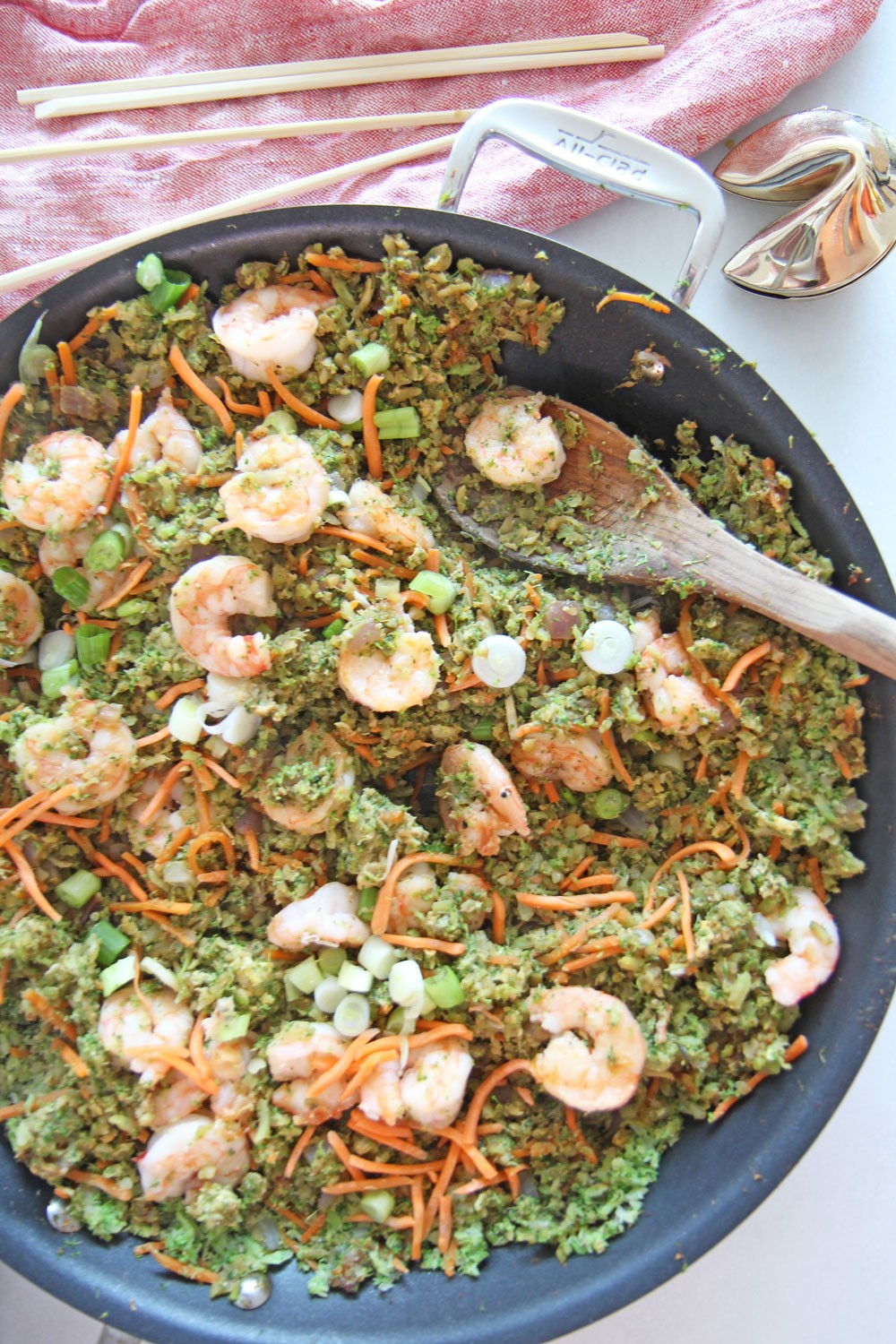 Shrimp and Broccoli Fried Rice. Fast dinner idea because use broccoli rice. Grab broccoli, garlic, ginger, onions, and shrimp. For the sauce its a combo of hoisin sauce, soy sauce, and rice wine vinegar. This is faster then take out and super fun Weeknight dinner. Happy Cooking! www.ChopHappy.com #friedrice #lowcarbrecipe