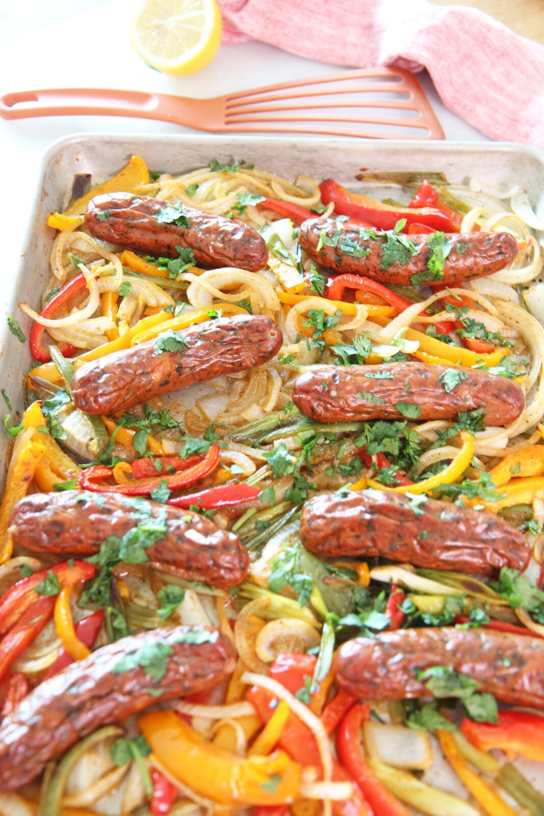 Sheet Pan Mexican Chicken Sausage and Peppers Recipe. This is a super quick sheet pan dinner. Grab smoked chicken sausage, peppers, jalapenos, adobo sauce, and fun herbs. Happy Cooking! www.ChopHappy.com #sheetpanrecipe #chickensausage 