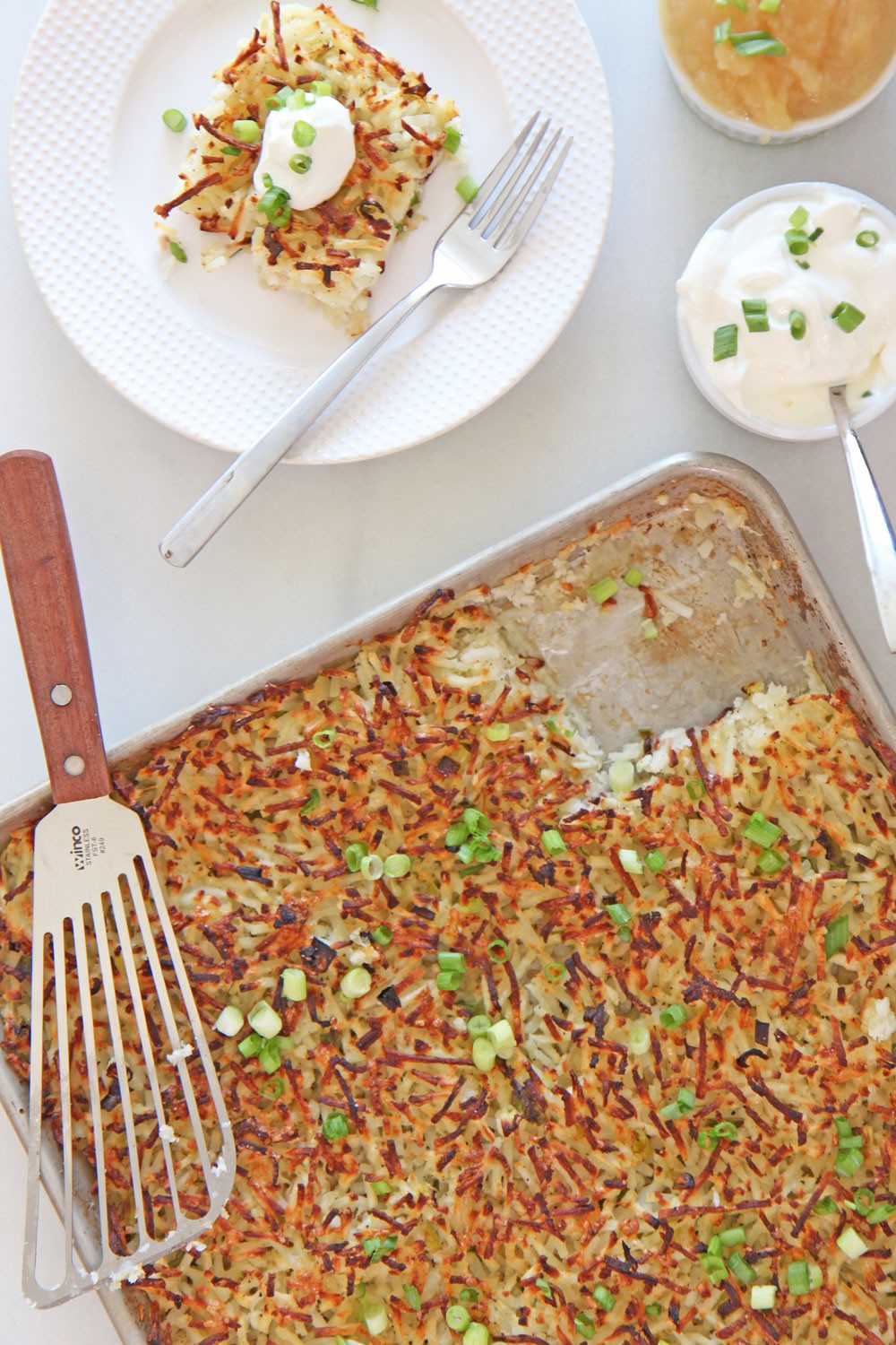 Huge Sheet Pan Potato Pancake (Latkes) Recipe. Easy way to make potato pancakes. No grating the potatoes, no squezzing out water, and no messy frying. All done on a sheet tray. www.ChopHappy.com #potatopancakes #latkes