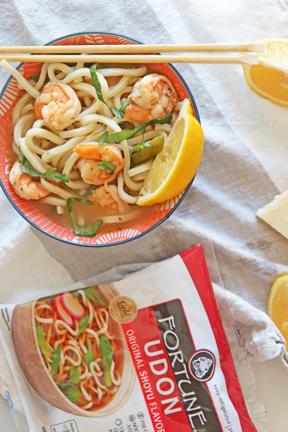 Shrimp Scampi Udon Noodle Soup Recipe. Simple 30 minte recipe that is one pot and comfort food yum. This is garlic, lemon, and chicken broth love mixed with udon noodles. Happy Cooking! www.ChopHappy.com #noodlesoup #shrimpscampi