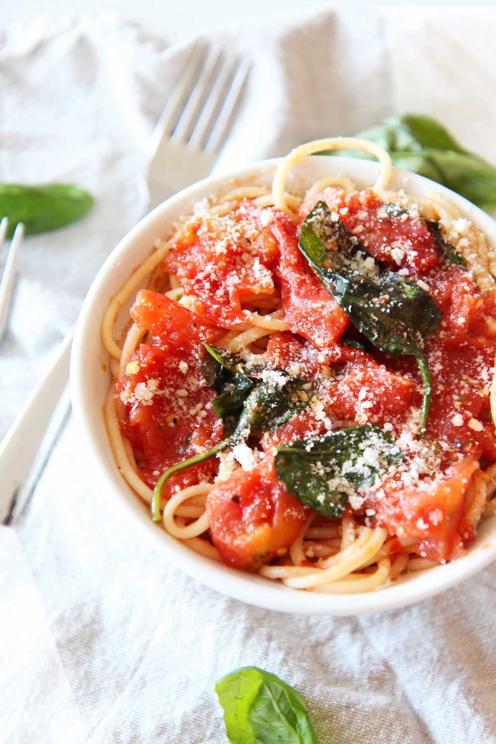 How To Make 5 Ingredient Pantry Marinara. Canned tomatoes, garlic powder, oregano, red pepper flakes, and fresh basil (you can use dried if needed) is all you need for a quick marinara sauce. This recipes is bright, sweet, and almost like having fresh marinara straight from the garden (but from your pantry lol). Happy Cooking! www.ChopHappy.com #marinararecipe #howtomakepastasauce