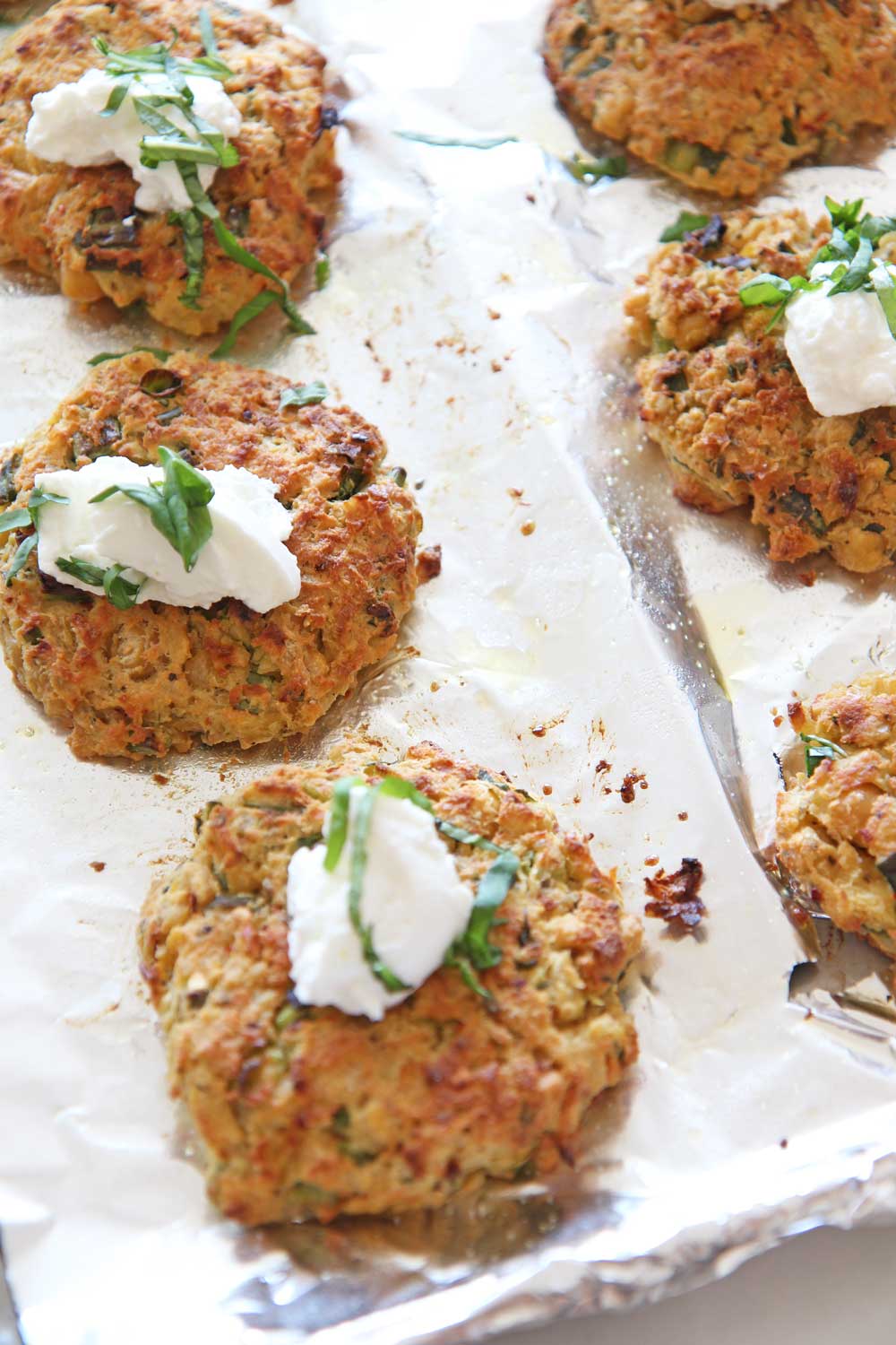 Cheesy Italian Chickpea Fritters (easy pantry recipe). Pantry ingredients make amazing dinners. By using the sheet pan this is a healthy recipe. No frying makes this healthier but also less mess. Grab chickpeas, ricotta, garlic powder, eggs, oregano, red pepper flakes, bread crumbs, and salt/ pepper. Happy Cooking! www.ChopHappy.com #chickpeas #pantryrecipe