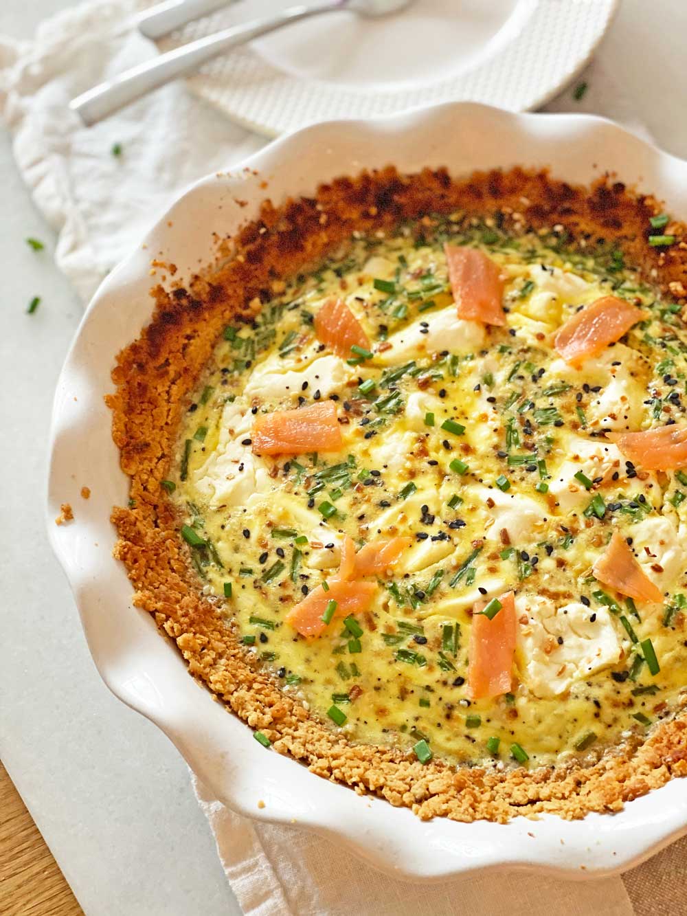 Bagel and Lox Quiche with Matzo Pie Crust Recipe. Perfect Passover recipe that is kosher for Passover. This tasted like a bagel with lox and cream cheese on an hot everything bagel. Lox, cream cheese, everything bagel seasoning, chives, eggs, and milk make up this awesome recipe. You can eat this for brunch, breakfast, dinner, or a snack. Happy Passover! www.ChopHappy.com #Passoverrecipe #matzo