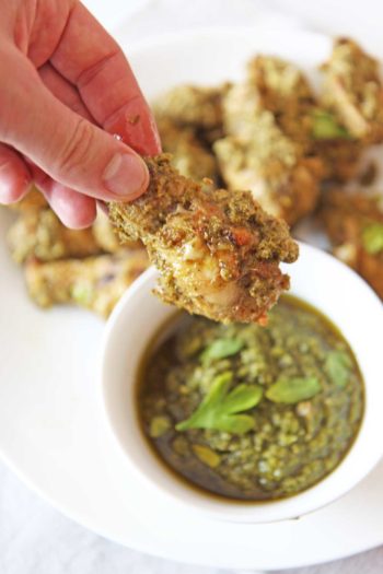 Oven Fried Pesto Chicken Wings. Easy 30 minute wing recipe with easy store bought pesto. www.ChopHappy.com #chickenwings #ovenfriedwings