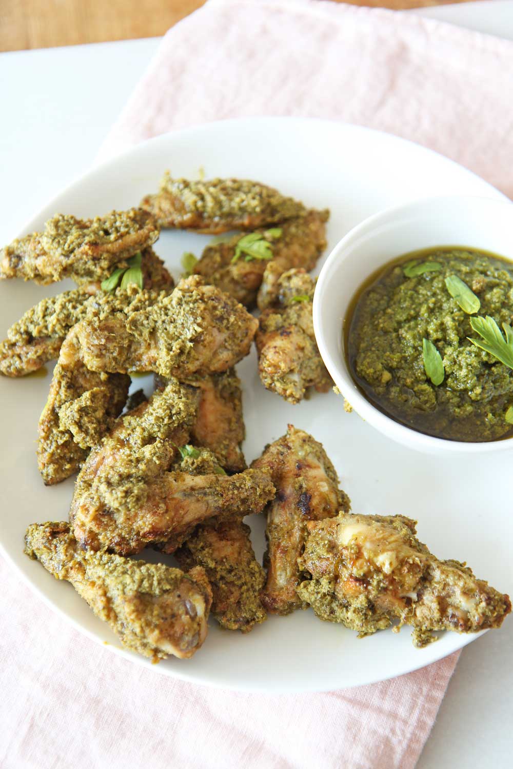 Oven Fried Pesto Chicken Wings. Easy 30 minute wing recipe with easy store bought pesto. www.ChopHappy.com #chickenwings #ovenfriedwings