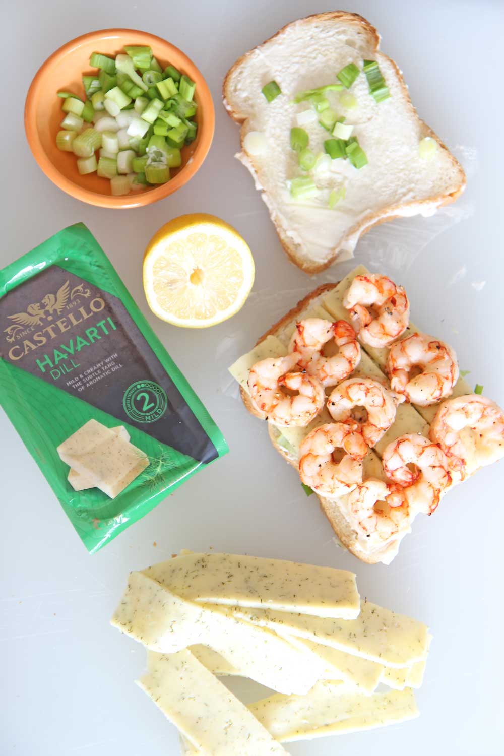 Shrimp and Dill Havarti Grilled Cheese Recipe. Bread, Castello Dill Havarti, mayo, lemon and scallions are all you need. This is a fast crunchy cheesy comfort food delight for a happy dinner. Happy Grilled Cheese Eating! www.ChopHappy.com #Ad #CastelloCheese #GrilledCheese