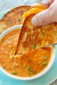 How To Make The Best Tomato Soup. Place tomatoes, shallots, roasted garlic, and seasoning on a sheet pan and roast in the oven. This is a simple soup recipe that has grilled cheese dunking fun. Happy Tomato Soup Cooking! www.ChopHappy.com #tomatosoup #roastedtomatosoup