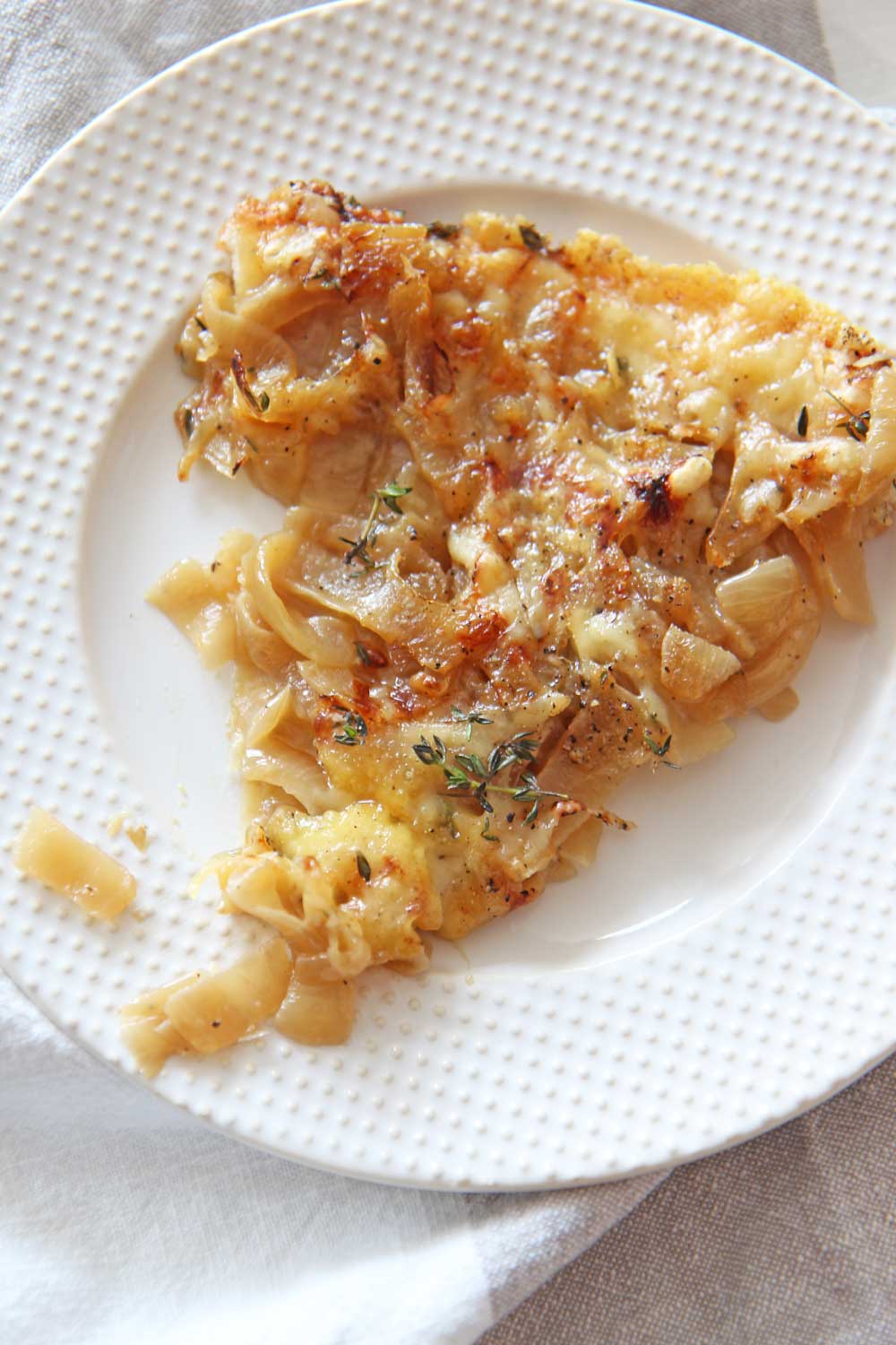 French Onion Soup Pizza. Add caramelized onions, pizza dough, Dijon, and lots of cheese. Easy pizza recipe at home. www.ChopHappy.com #howtomakepizza #Frenchonionsoup