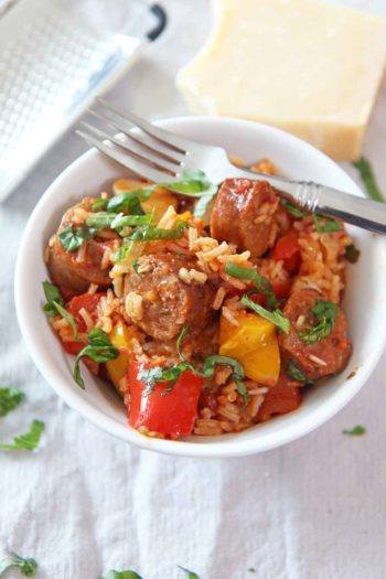 How to Make Sausage and Pepper Rice Recipe. This is an easy one pot dinner idea that takes the sausage and pepper sandwich and makes it a rice recipe! Happy Cooking! www.ChopHappy.com #ricerecipe #sausageandpeppers