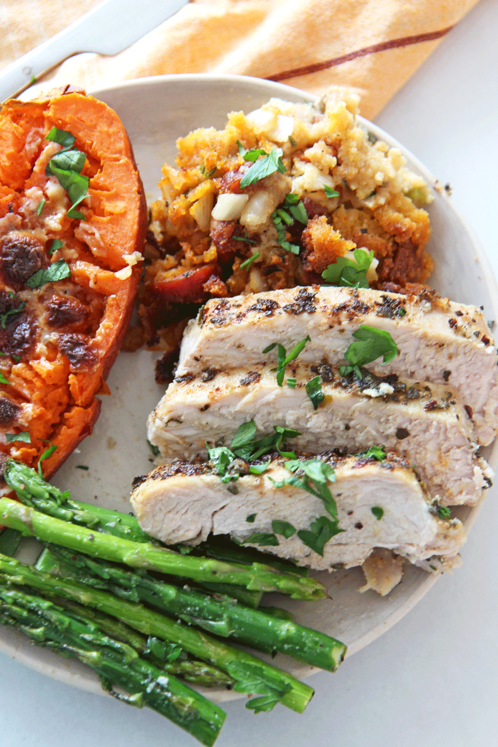 Thanksgiving Dinner on a Sheet Pan (Thanksgiving for 2). This thanksgiving is done cooking in 2 hours and less clean up because all done on a sheet pan. We will make cornbread chorizo stuffing, sweet potatoes with marshmallows, and roasted asparagus. The turkey will be the juiciest turkey with an amazing Thanksgiving hack. Happy Thanksgiving! www.ChopHappy.com #Thanksgivingdinner #bestturkeyrecipe