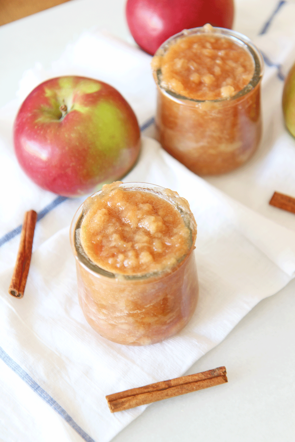 How to Make Applesauce in a Slow Cooker. Apples, butter, brown sugar, cinnamon, orange juice, and salt are all you need. This is an easy slow cooker recipe for fall or Hanukkah. Happy apple cooking! www.ChopHappy.com #applerecipes #applesauce