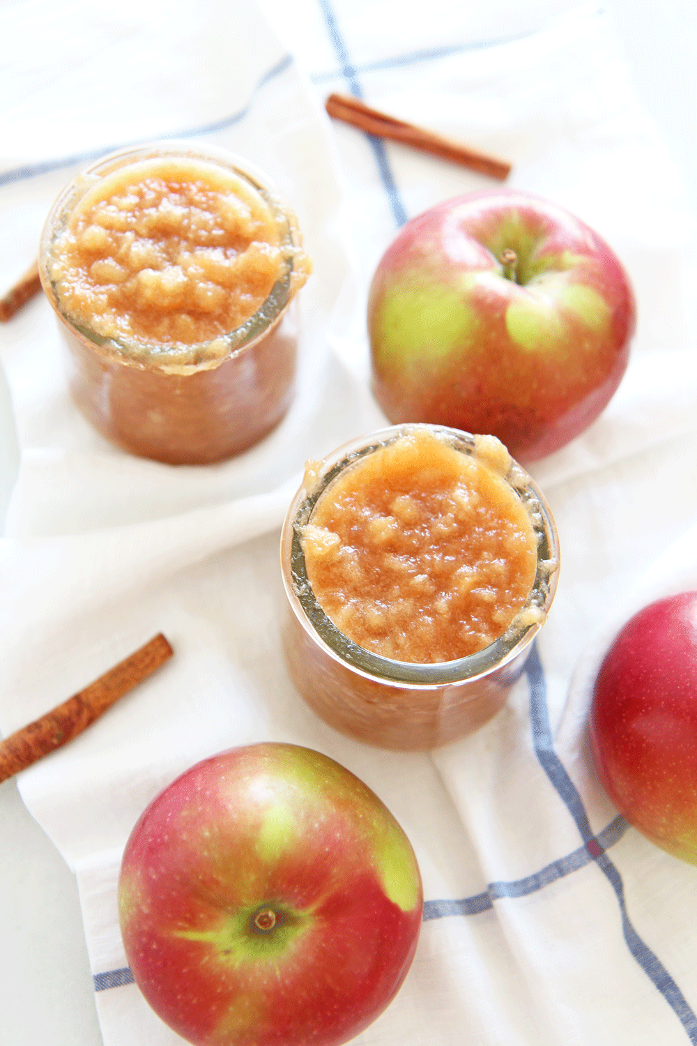 How to Make Applesauce in a Slow Cooker. Apples, butter, brown sugar, cinnamon, orange juice, and salt are all you need. This is an easy slow cooker recipe for fall or Hanukkah. Happy apple cooking! www.ChopHappy.com #applerecipes #applesauce