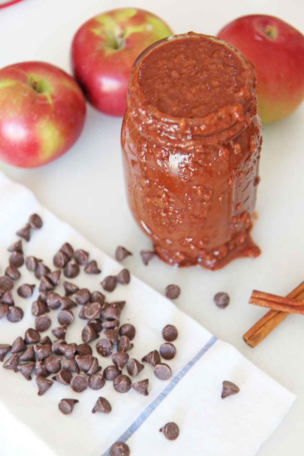 How to Make Chocolate Applesauce in a Slow Cooker.Apples, butter, brown sugar, cinnamon, orange juice, and salt are all you need. This is an easy slow cooker recipe for fall or Hanukkah. Happy apple cooking! www.ChopHappy.com #applerecipes #applesauce