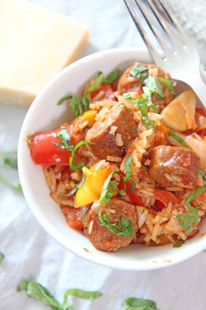 How to Make Sausage and Pepper Rice Recipe. This is an easy one pot dinner idea that takes the sausage and pepper sandwich and makes it a rice recipe! Happy Cooking! www.ChopHappy.com #ricerecipe #sausageandpeppers