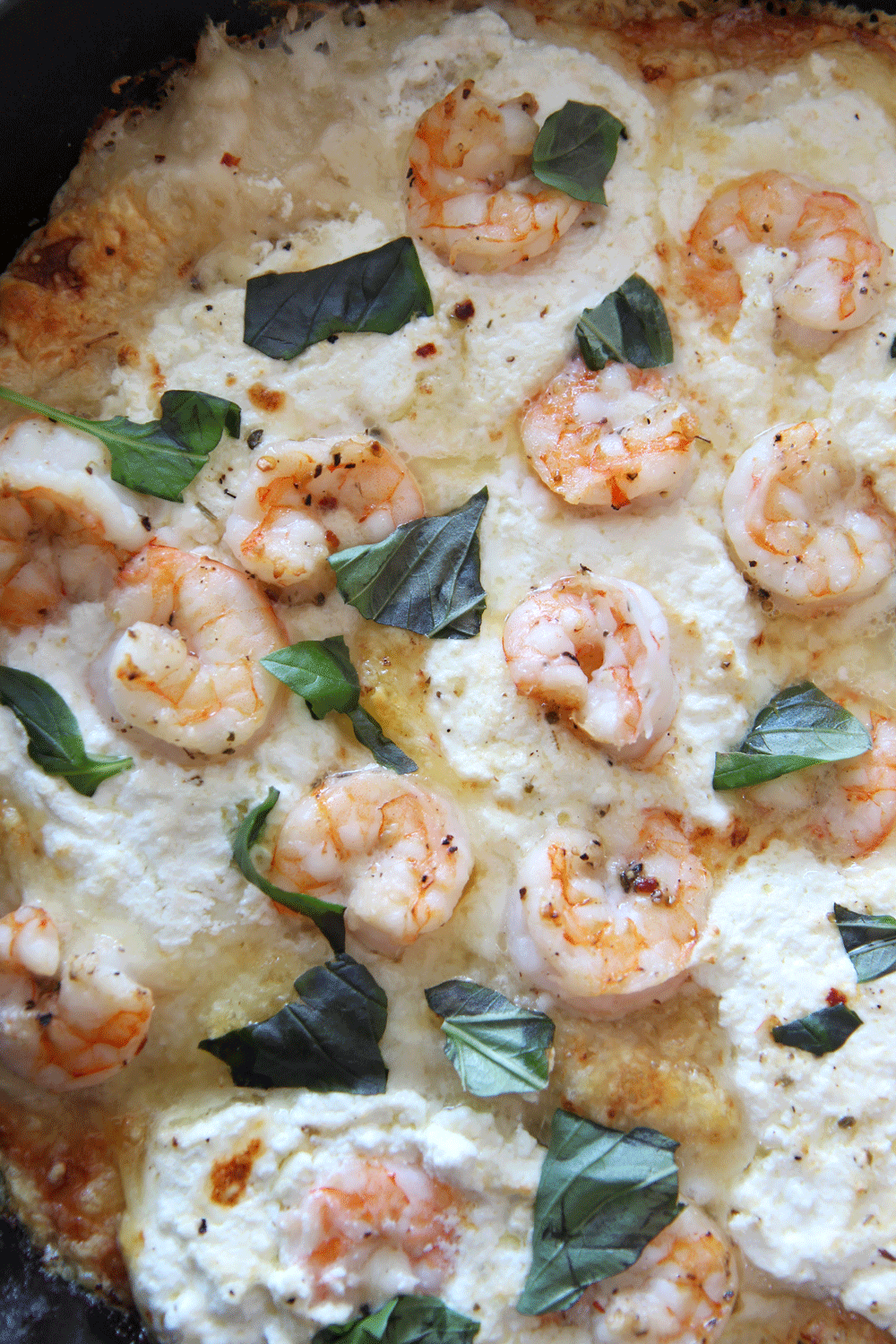 Shrimp Scampi Pizza in a Cast Iron Pan. This is the perfect one pan dinner that is done in 10 minutes. You cook the pizza in a cast iron pan for crispy cheesy crust. Happy Pizza Making! www.ChopHappy.com #Howtomakehomemadepizza #shrimpscampi